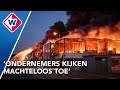 Explosies bij gigantische brand in bedrijfshallen Ter Aar