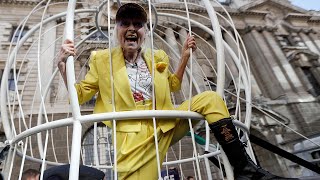 video: Dame Vivienne Westwood suspends herself in cage in support of Julian Assange