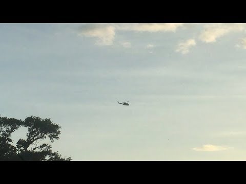 UH-1 Huey Flies Into the Sunset Over Cocoa Beach Florida