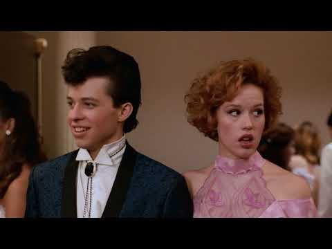 Close-up of Andie and Duckie navigating the dance floor as an 80s synth-pop track plays
