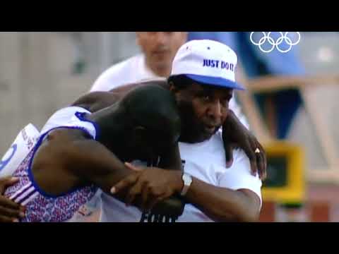 Derek Redmond's father helps him across the finish line at the 1992 Olympics