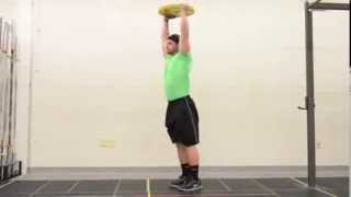 63. Overhead Plate Forward Lunge