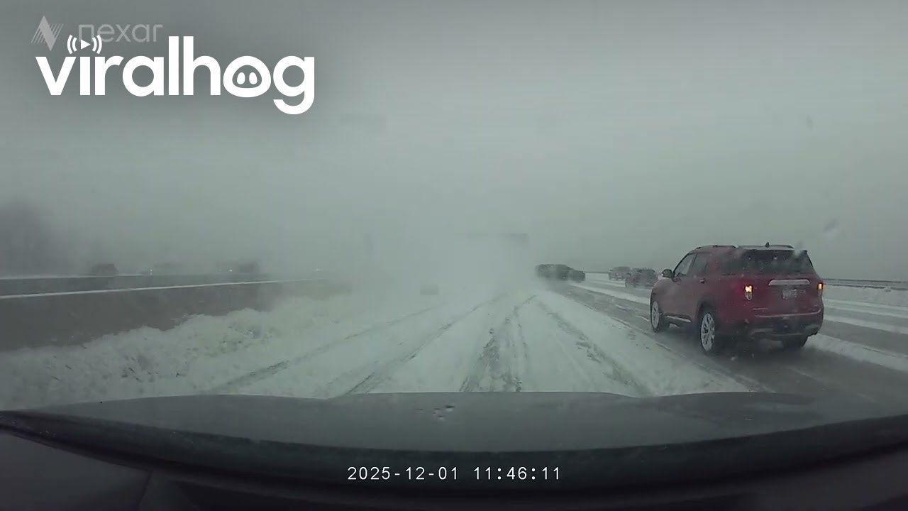 SUV Slides Across Several Lanes During Snowstorm || ViralHog
