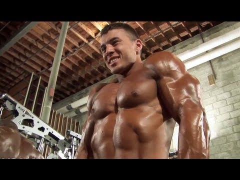 Bodybuilder Mike Carr Pumps Up Backstage
