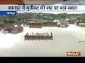 UP: Policemen get stuck at a water-logged road in Kanpur