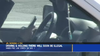 New law prohibits holding cell phone while driving