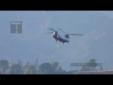 Chinook Firefighting Helicopter Arriving at a Reservoir to Refill Water Tank