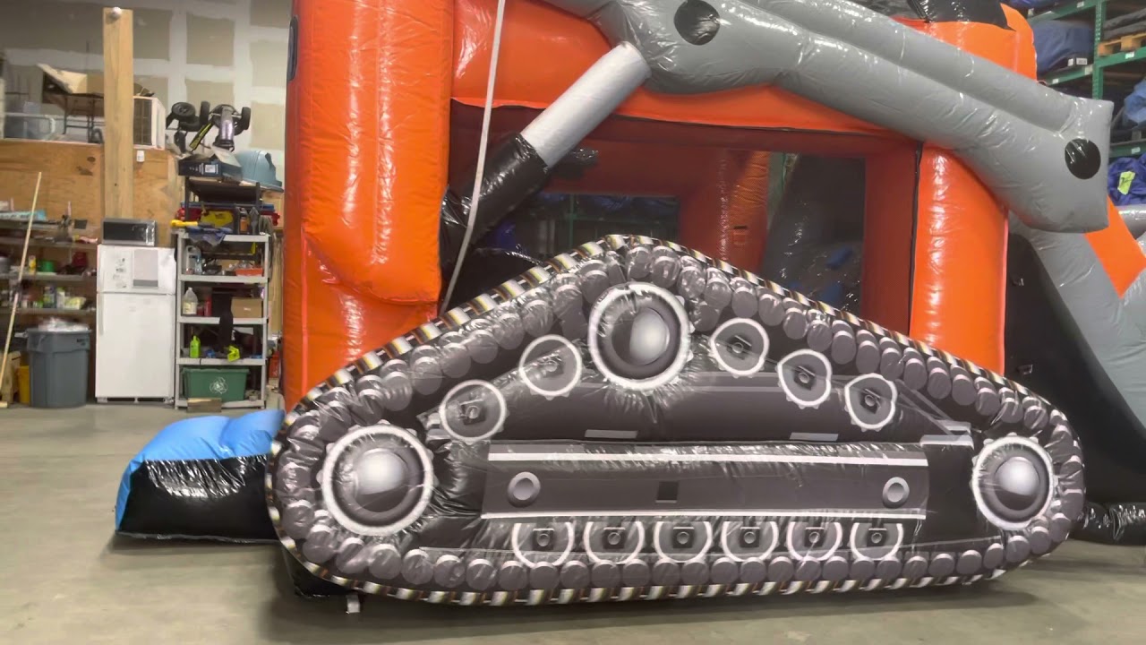 Skid loader bounce house combo rental from About to bounce inflatable rentals.