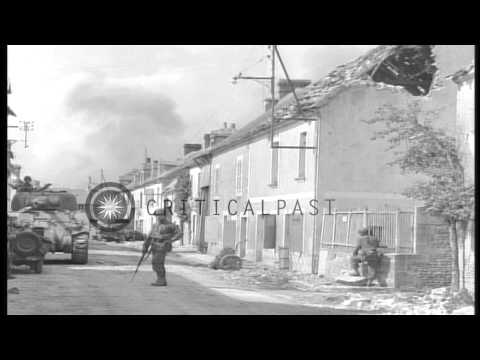 United States 90th Infantry Division troops patrol in streets of Chambois, France...HD Stock Footage