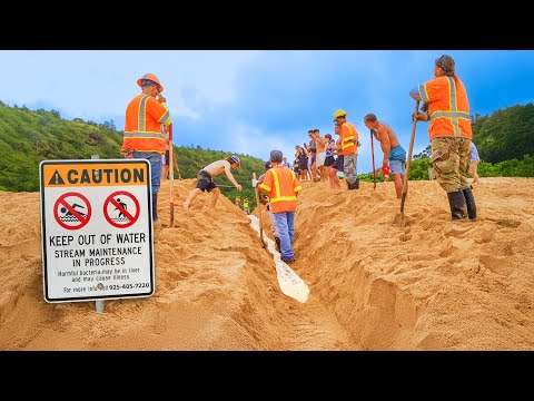 CITY WORKERS CONNECT RIVER TO OCEAN