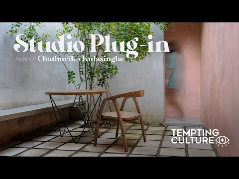 Small linear studio with a rustic pink feature wall