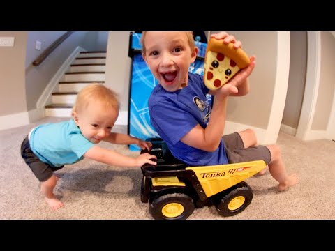 Baby Pushes Big Brother In Truck!