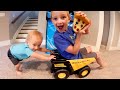 Baby Pushes Big Brother In Truck!
