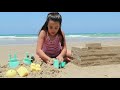 Watch this girl build this amazing sand castle!