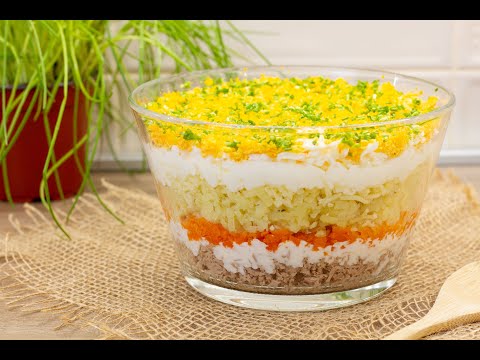 Mimosa salad i.e. beautifully looking layered tuna salad with root vegetables, eggs and mayonnaise.