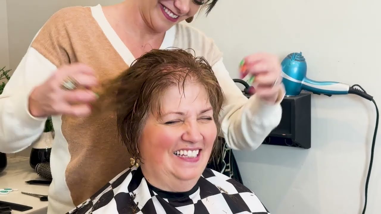 Linda's sleek bob at 61 — natural silver, beautifully polished, the elegant bob result for women over 50 who want length with structure