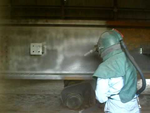 Brush blasting steel i beams
