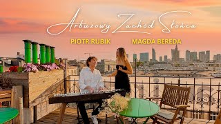 Kadr z teledysku Arbuzowy zachód słońca tekst piosenki Magda Bereda i Piotr Rubik