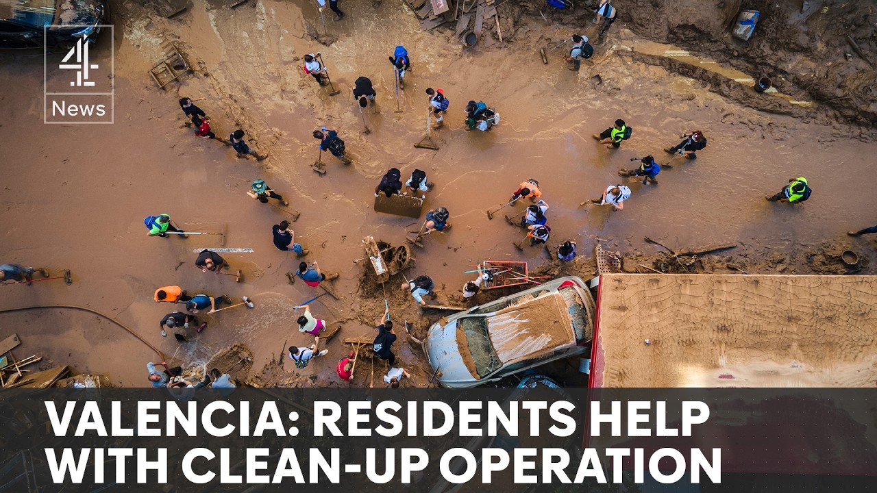 Spain floods: soldiers and army of volunteers work to clear wreckage
