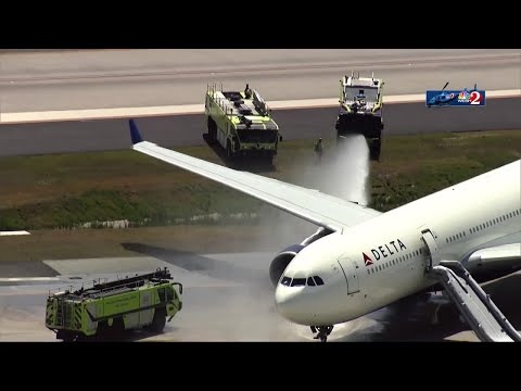 WATCH:  Firefighters extinguish fire reported on Delta plane at Orlando International Airport