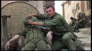 US Military personnel pose for photos with dead enemy soldiers