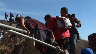 Migrant caravan: Hundreds rush border, tear gas fired