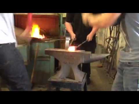 Forging a titanium billet at the national school of blacksm