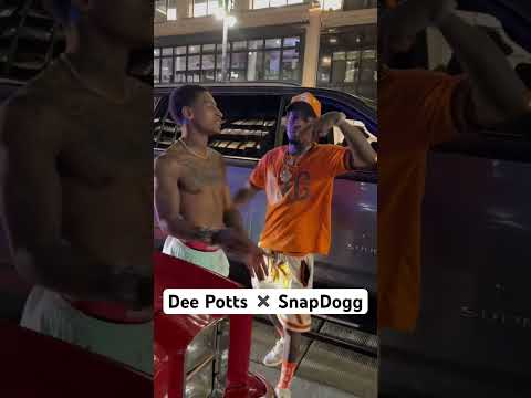 Dee Potts &SnapDogg  Posted Downtown Detroit