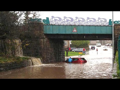 Homes and roads flood after heavy rain in Lancashire and north Wales