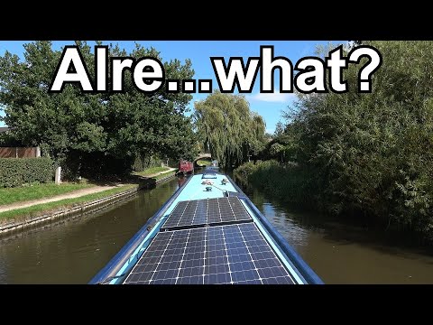 226. Narrowboat cruising through a village with an unpronounceable name