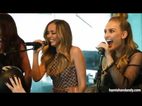 Little Mix laughing while singing
