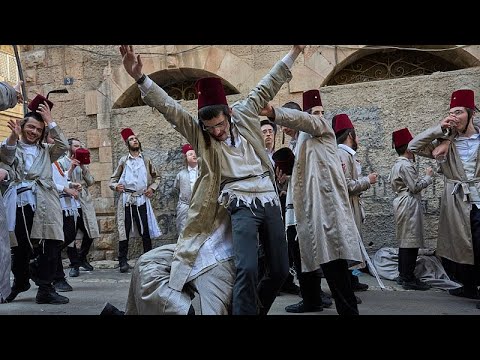 Video Thumbnail: Jerusalem holds annual Purim parade with yellow ribbon symbolising hostages