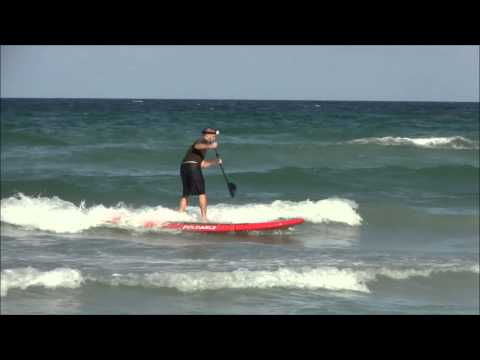Surfing waves with Foldable Paddle Board.