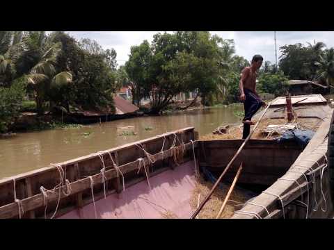 Life on the River Mekong Delta - An old man lives alone in a Boat