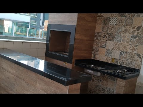churrasqueira gourmet com acabamento em porcelanato e balcão de granito!!