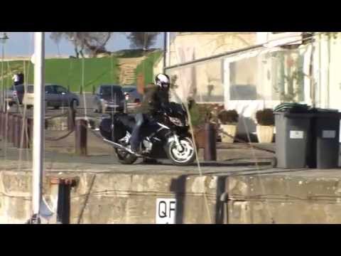 A biker falls into the port