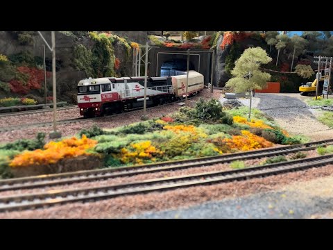 SCT Intermodal passing Pacific National work train on Modern Steel on the Hawkesbury layout