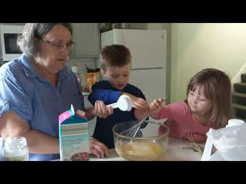 Elisha making his birthday cake with Grandma Georgann