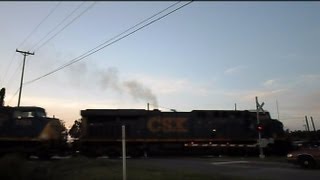 preview picture of video 'CSX Intermodal Train Through Crossing At Sunset'
