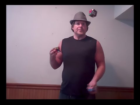 Solving Three Mixed Up Rubik's Cubes While Juggling Them