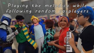 Playing the melodica while following random cospla