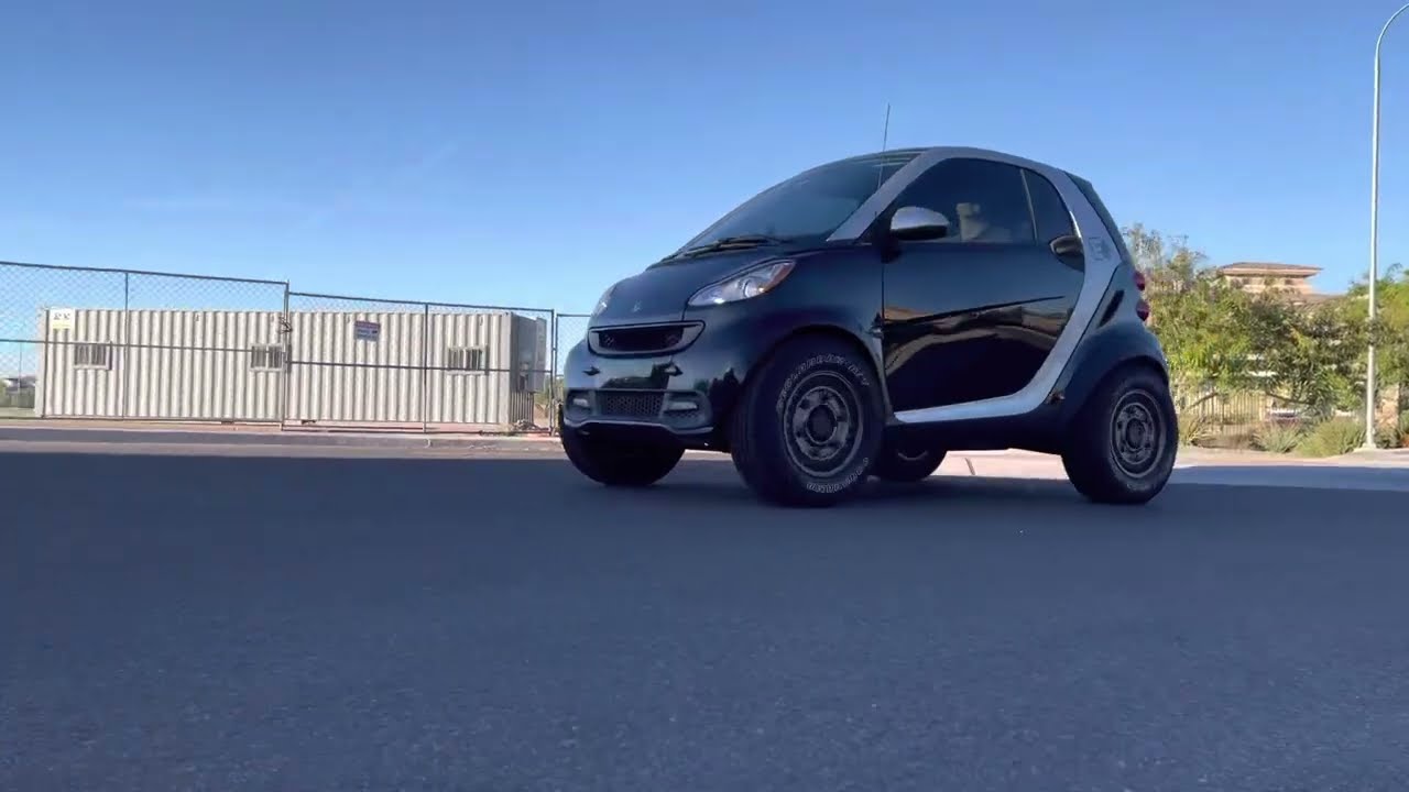 My Lifted Smart car driving over median!