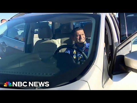 High school volleyball team surprises custodian with car