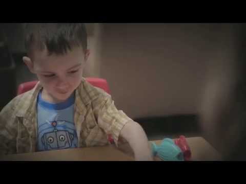 Kingston sitting at a table with toys