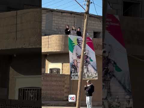 عاموادا اليوم.. استقبال قافلة مؤسسة بارزاني الخيرية بصورة البارزاني الخالد 