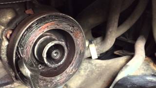 Nissan Murano AC Clutch Pulley Repair including removing serpentine belt.