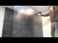 Breaking tempered glass shower wall door.