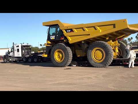 The CAT 777 F being loaded on the deck of a (13 Axle RGN).