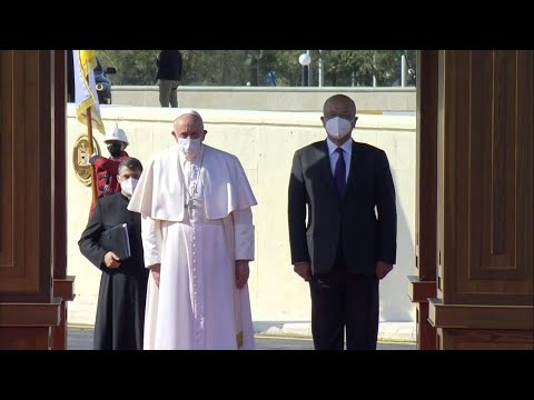 Pope Francis is welcomed by Iraqi President Barham Saleh at presidential palace | AFP