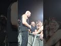 Disturbed stops show to comfort scared girl